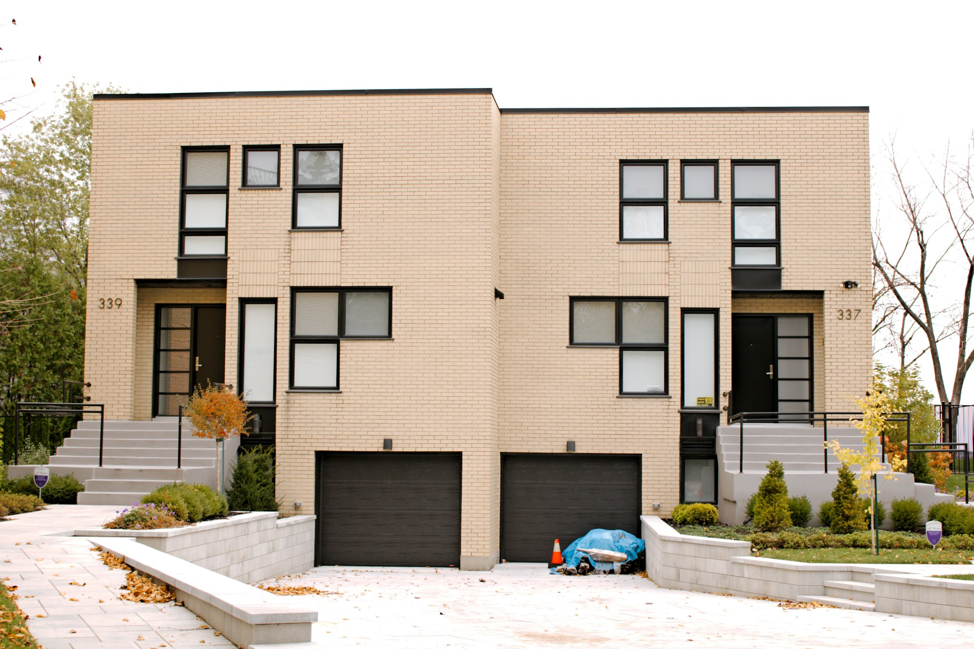 Modern side-by-side infill with two front garages